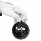 Swish 80mm portable golf ball cleaner in hand - Black